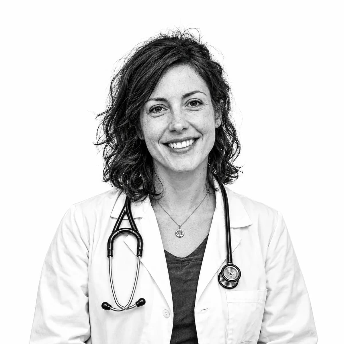 Smiling doctor in a white coat with a stethoscope around her neck
